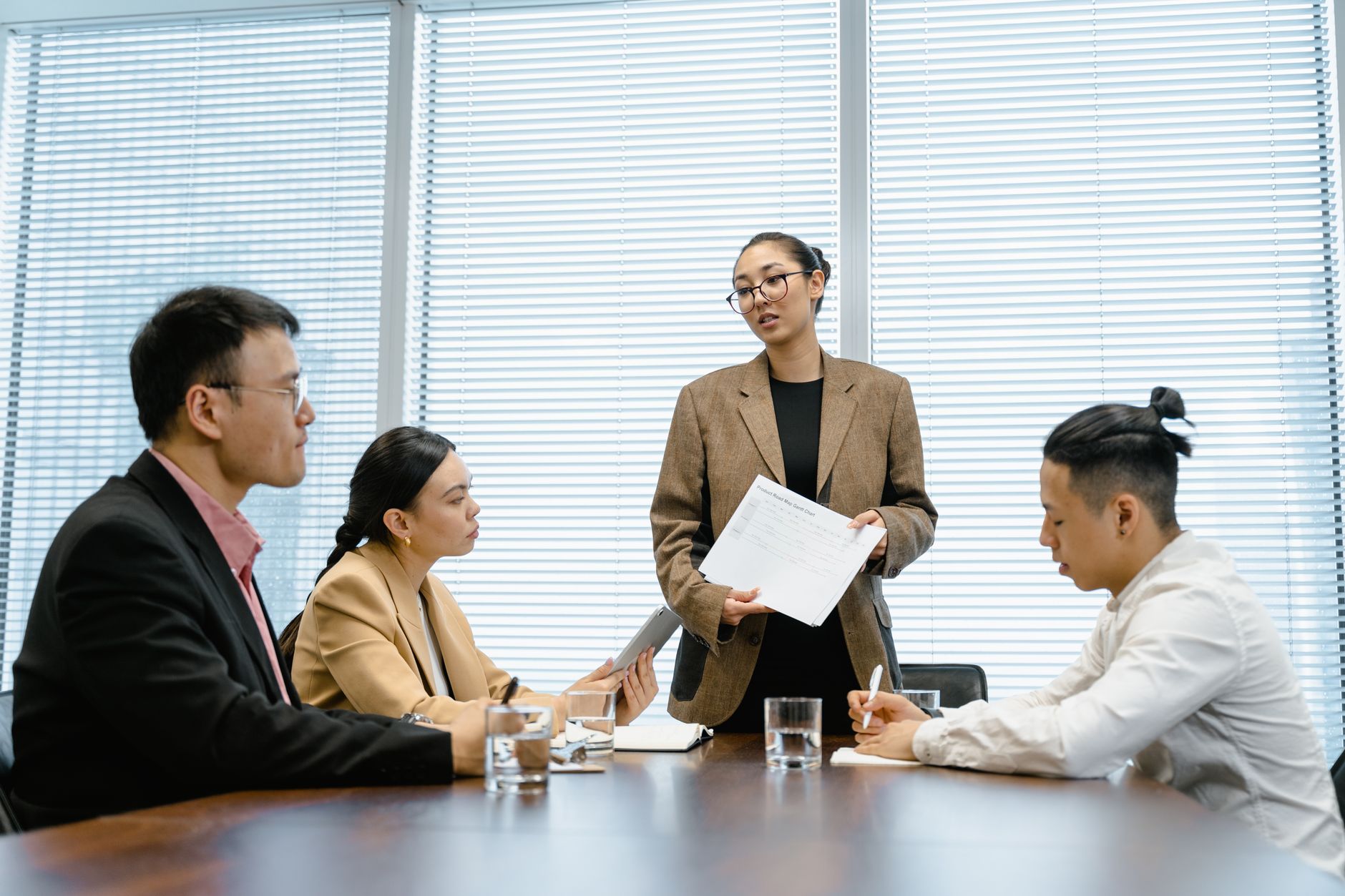 Professional corporate brokers in board room meeting